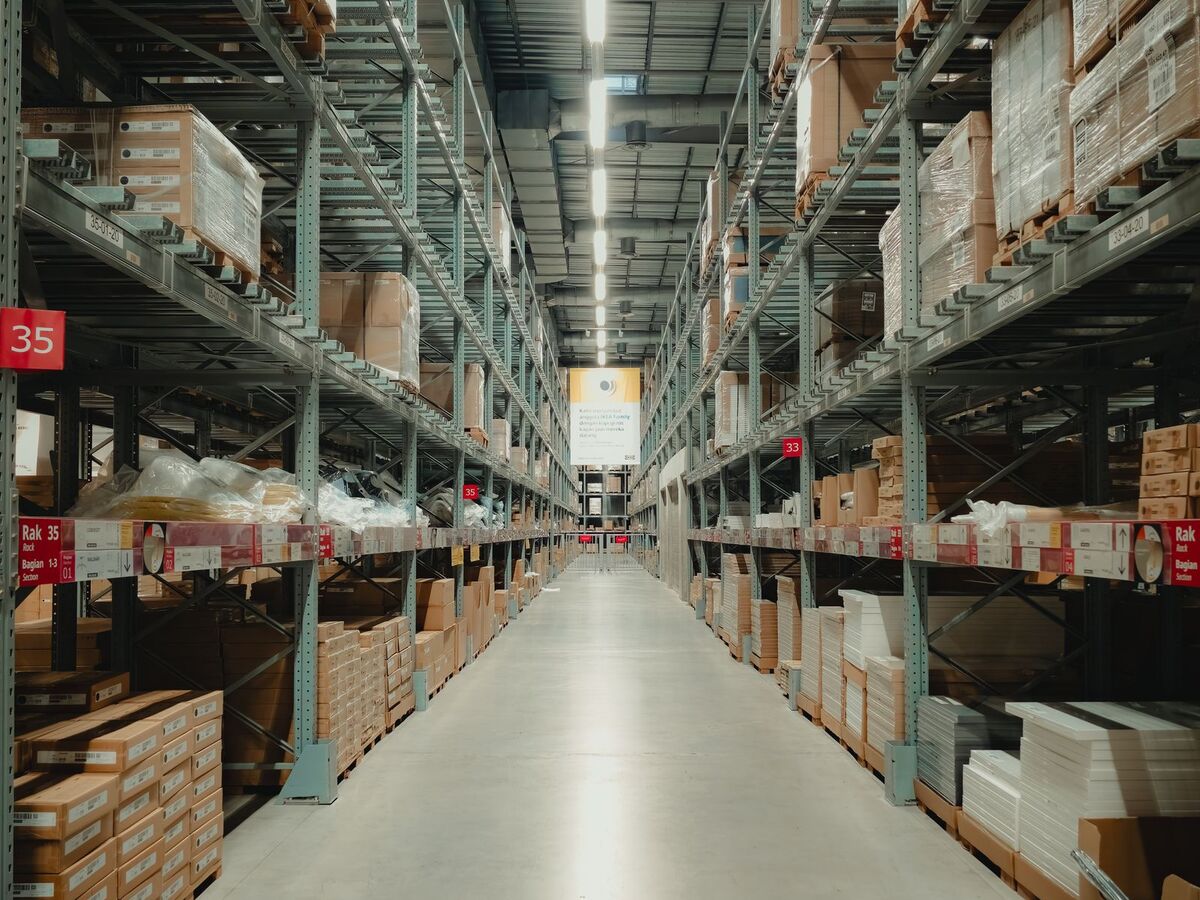 A long aisle of stocked warehouse racking